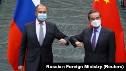 Сергей Лавров  жана Ван И. Кытай, 2021-жылдын 22-марты.