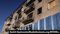 Пошкоджені будинки в Ізюмі