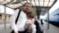 Ales Mikhalevich meets with his wife Milana and his daughter at the train station in Vilnius. 2011 (Photo by Julia Darashkevich)
