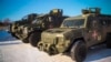 Armored vehicles made by the Ukrainian private joint-stock company AvtoKrAZ, which is one of five companies that Ukraine's National Security Council has commandeered under martial law.