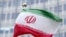 The flag of Iran flutters in the wind outside of the IAEA headquarters during the International Atomic Energy Agency IAEA's Board of Governors meeting at the agency's headquarters in Vienna, Austria, on November 20, 2024.