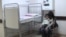 Armenia -- A child suffering from a respiratory virus and his mother wait in the hallway of Arabkir hospital, 8Jan2016