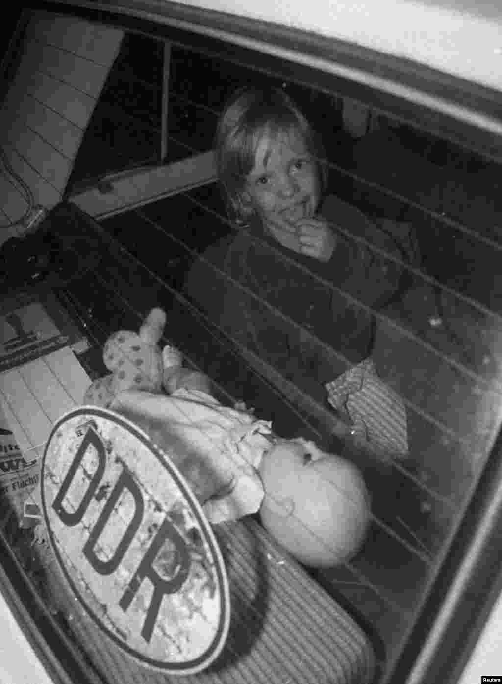 A child rides in an East German car at the Hegyeshalom border crossing.