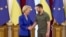 European Commission chief Ursula von der Leyen and Ukrainian President Volodymyr Zelenskiy shake hands before a meeting on September 15. 