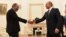 Armenian Prime Minister Nikol Pashinian (left) shakes hands with Russian President Vladimir Putin at a meeting in Moscow in June. 