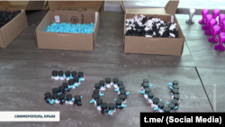 Drone parts made by students at a school in Simferopol, a city in Russia-occupied Crimea, are seen arranged into the letters that Russia uses to symbolize its invasion of Ukraine.
