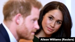 Гарри менен Меган.
