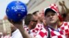 A Croatian supporter holds a ball saying, "Accept Kosovo in UEFA" in Poznan, Poland, during the European soccer finals in 2012.
