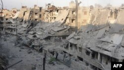 Зруйновані будівлі після боїв урядових військ і повстанців у Хомсі