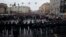 Russian law enforcement officers block a road as protesters march during a rally in support of jailed Russian opposition leader Alexei Navalny in St. Petersburg on January 23. 