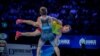 Корлан Жаканша (в желтой форме) на чемпионате мира по борьбе. Нур-Султан, 15 сентября 2019 года.