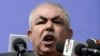 Afghanistan -- Afghan vice-presidential candidate Abdul Rahid Dostum, who is campaigning with presidential candidate Ashraf Ghani Ahmadzai, addresses the crowd during a gathering in the outskirts of Kunduz province, March 19, 2014