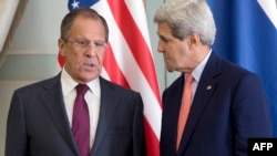 U.S. Secretary of State John Kerry (right) speaks with Russian Foreign Minister Sergei Lavrov during a meeting in Paris on October 14. 
