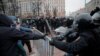 Law enforcement officers clash with participants during a rally in support of jailed Russian opposition leader Aleksei Navalny in Moscow on January 23.