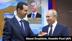 Cириянын мурдагы президенти Башар Асад Орусиянын лидери Владимир Путин менен,  7-июнь, 2020-жыл