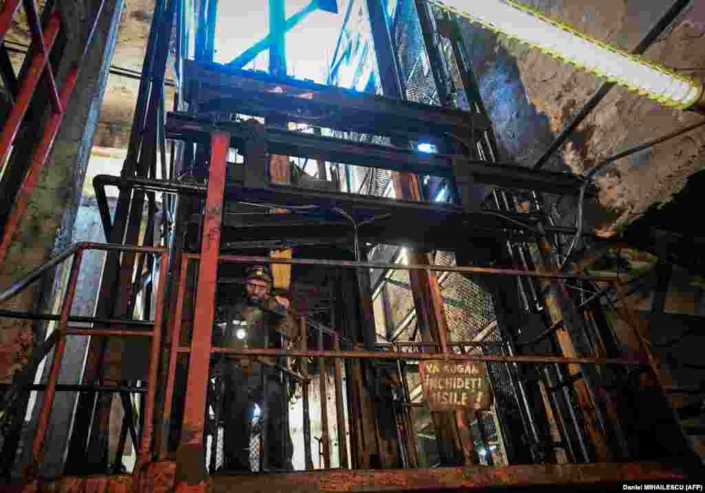 A miner exits an elevator as he ends his shift.