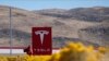 The U.S. Justice Department says Yegor Kryuchkov offered a Tesla employee $1 million to install malicious software to get access to the firm's networks as part of an extortion scheme.