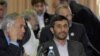 Наблюдатели полагают, что конференцию в Тегеране президент Ахмадинеджад (справа) использует в качестве пиар-акции