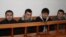 Четверо из группы узбекских беженцев-мусульман, которые были экстрадированы из Казахстана, во время суда над ними. Алматы, 11 марта 2011 года.