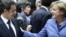 Николя Саркози и Ангела Меркель: два главных действующих лица на саммите ЕС.