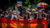 People carry rainbow-colored banners and flags during a gay-pride parade in Belgrade in June.