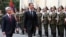 Armenia -- The presidents of Armenia and Syria inspect a guard of honor outside the presidential palace in Yerevan on June 17, 2009.