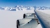 A NASA photo shows the wing of a DC-8 as it flies past Antarctica's tallest peak, Mount Vinson, during research on polar warming in 2012.