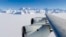 A NASA photo shows the wing of a DC-8 as it flies past Antarctica's tallest peak, Mount Vinson, during research on polar warming in 2012.