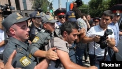 Armenia - Police detain a youth activist protesting against bus fare hikes in Yerevan, 23Jul2013.