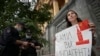 A journalist holds a placard which reads "Foreign agents yourself" near the headquarters of Federal Security Service in Moscow (file photo)