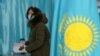 KAZAKHSTAN-ELECTION/ - A voter wearing protective mask votes during a parliamentary election in Almaty, Kazakhstan January 10, 2021.  REUTERS/Pavel Mikheyev