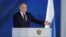 Russian President Vladimir Putin gives his speech to both houses of parliament in Moscow on April 21.