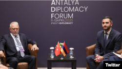 Turkey - Turkish envoy Serdar Kilic (left) and Armenian parliament vice-speaker Ruben Rubinian meet on the sidelines of the Antalya Diplomatic Forum, April 11, 2025.