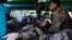 A medic treats a wounded Ukrainian soldier at a frontline stabilization ambulance in an undisclosed location near the frontline town of Kreminna, Ukraine, on March 13.