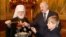 Єпископ Російської православної церкви (РПЦ), митрополит Мінський і Заславський, патріарший екзарх всієї Білорусі Павло (Пономарьов) разом із президентом Олександром Лукашенком і його сином Миколою