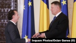 Romanian Prime Minister-designate Florin Citu (left) and President Klaus Iohannis (file photo)