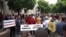 Protesters rally to show their anger at the attack on Montenegrin journalist Olivera Lakic in Podgorica on May 9.