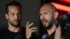Tristan and Andrew Tate (right) talk to reporters in front of their house in Romania after their return to the country on March 22.