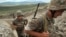Nagorno-Karabakh -- Armenian soldiers of the self-proclaimed republic of Nagorno-Karabagh walk in a trench at the frontline on the border with Azerbaijan near the northeastern town of Martakert, 06Jul2012