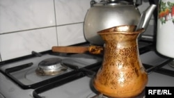 Armenia -- A gas stove with a coffee making ibriks on it, undated