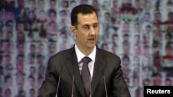 Президент Башар ал-Асад Дамасктын опера театрында сүйлөп жаткан учур. 6-январь, 2013