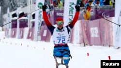 Russian Paralympian Roman Petushkov celebrates his gold medal in a biathlon at the 2014 Sochi Paralympic Games in March 2014. 