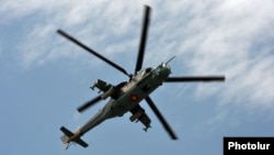 Armenia - An Armenian Mi-24 combat helicopter flies near Yerevan, 11Jun2014.