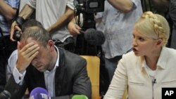 Юлія Цімашэнка і яе абаронца Сяргей Уласенка