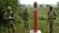 Belarusian guards stand at the border between Poland and Belarus in Krynki, Poland, on August 31.