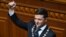 UKRAINE -- Ukrainian President-elect Volodymyr Zelenskiy holds the presidential stamp during his inauguration ceremony at the parliament in Kyiv, May 20, 2019