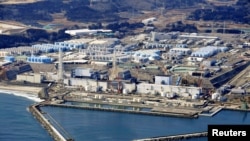 "Фукусима-1" атомдук электр станциясындагы суу сакталган резервуарлар. 13-февраль, 2021-жыл. Жапония, Окума шаары.