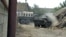 Daghestan -- Military vehicles during an operation against rebels in in the village of Kostek, 17Jun2010