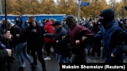 People take part in a rally organized by nationalists and far-right groups on National Unity Day in Moscow on November 4, 2020.