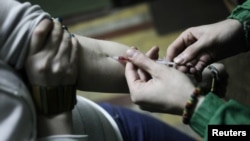 The head of Moscow's regional AIDS center says that over half of its cases of HIV have been contracted via drug use (file photo).